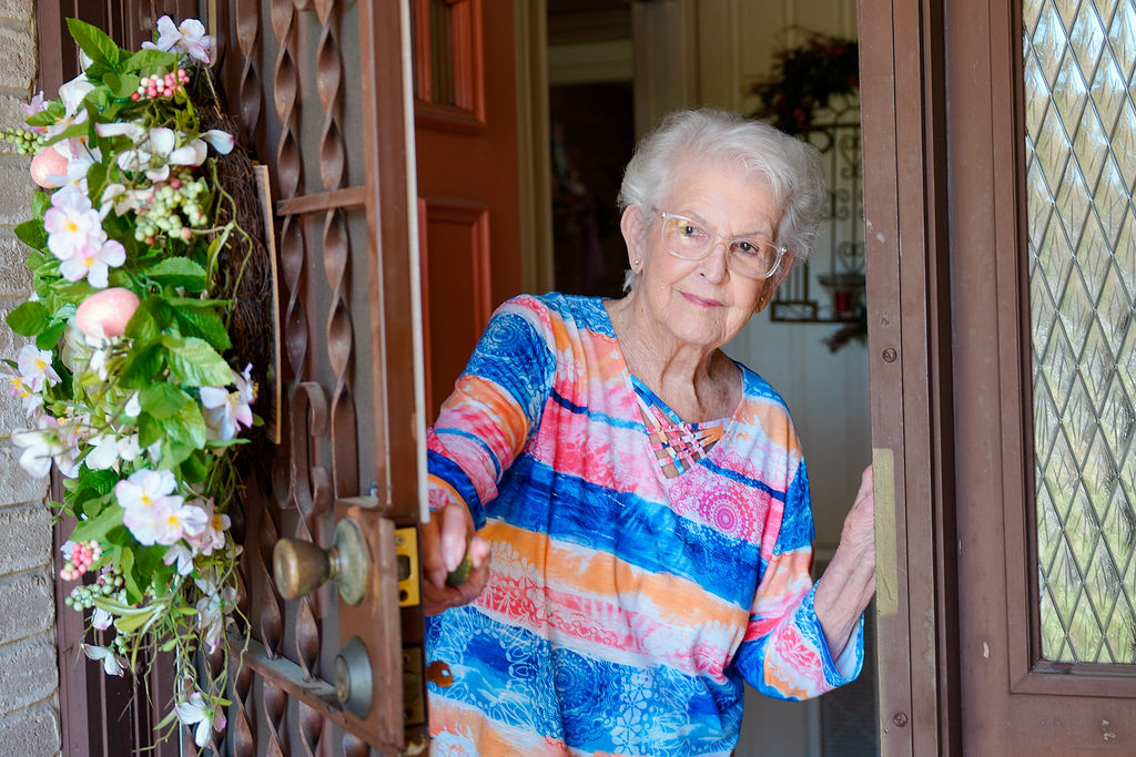 Mrs. Janie Meals on Wheels Client Opening Door