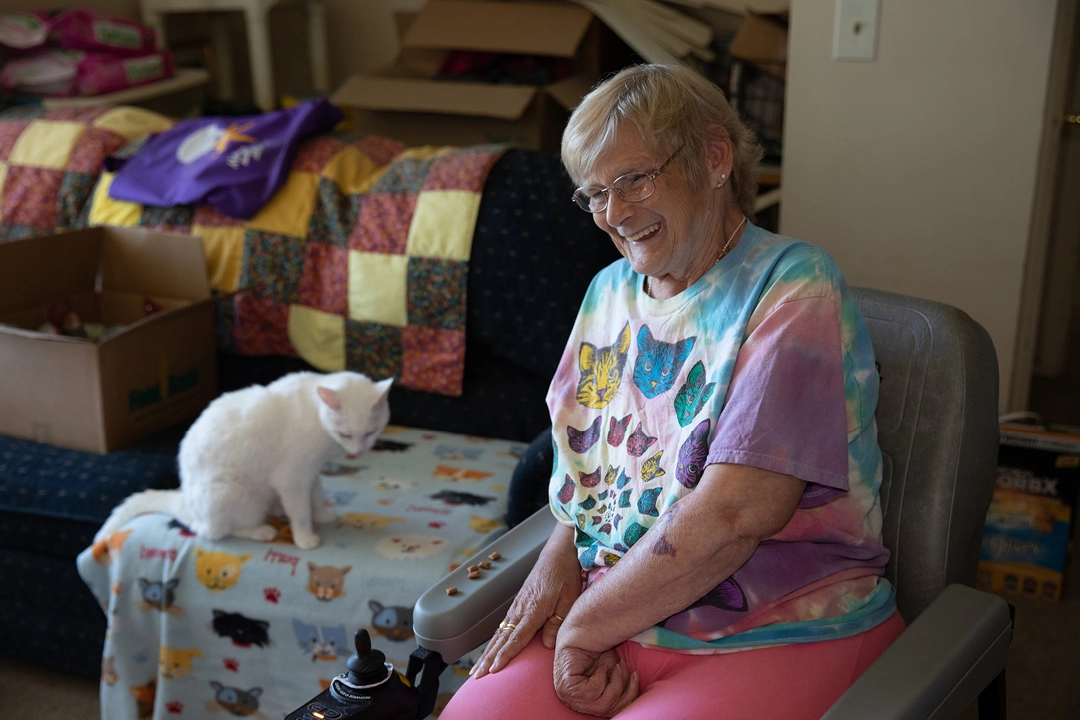 Senior client Joan and her cat, Snowball