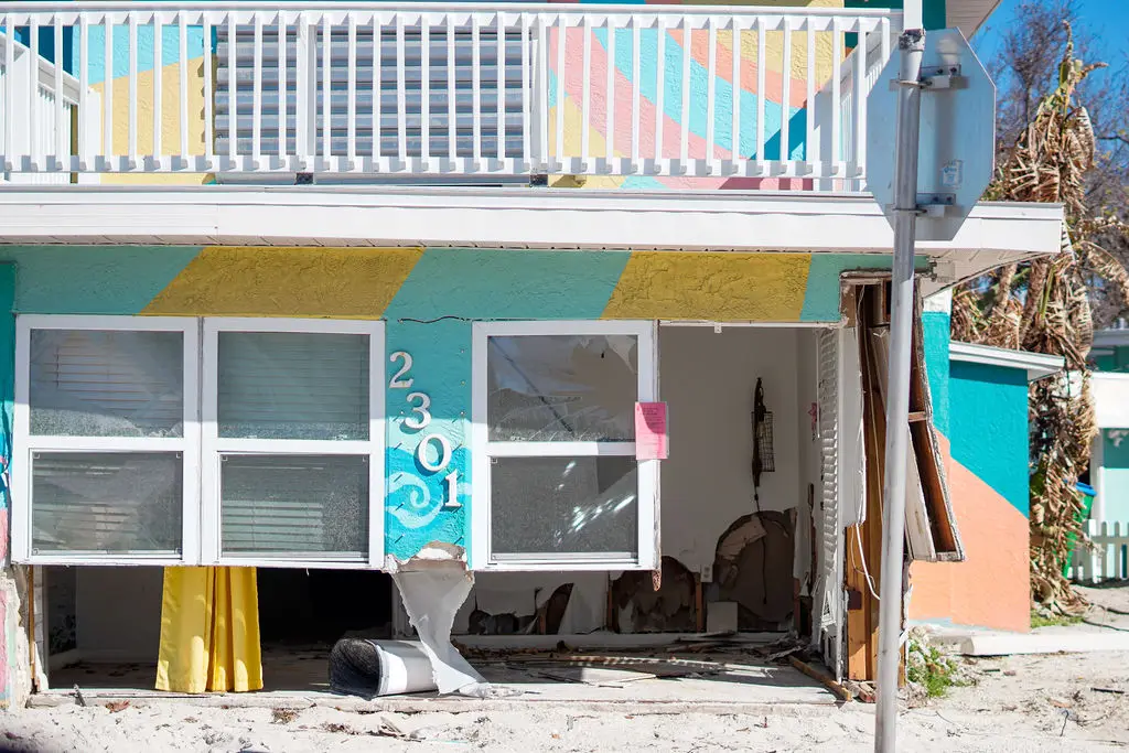 Colorful house damaged by hurricane.