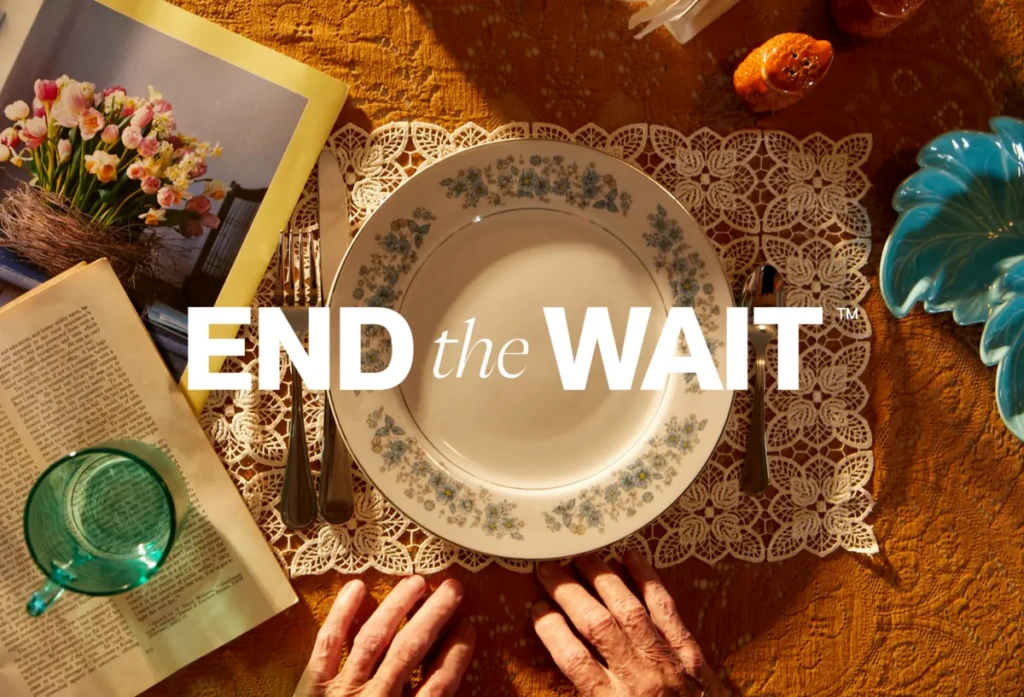End the Wait campaign image with White hands and empty plates and cup on table.