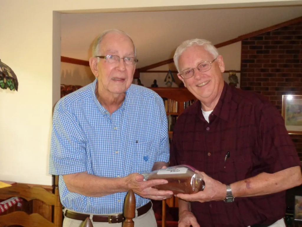 Bob Starkes and Meals on Wheels Recipient Paul with pumpkin bread