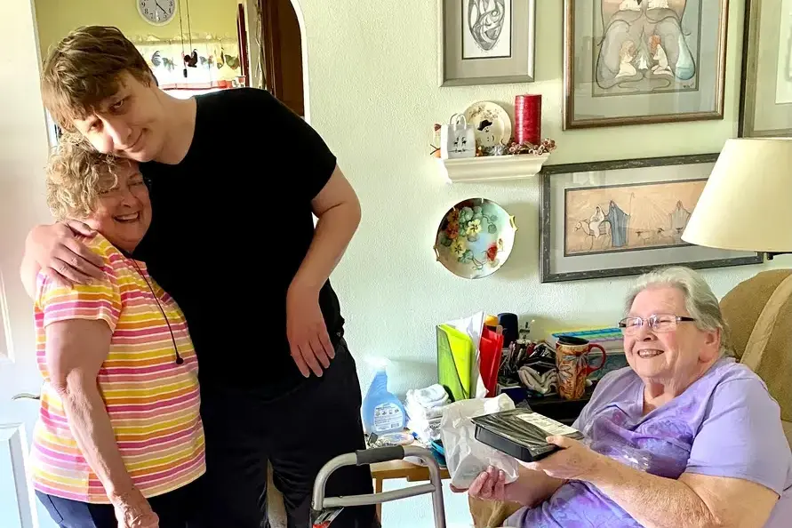 Billie Jo and Gabe hugging, along with Sharon