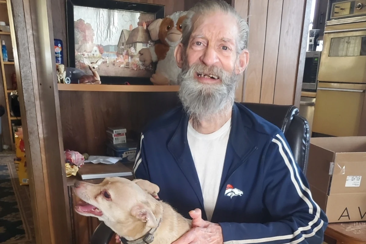 Albert smiling while holding Baby.